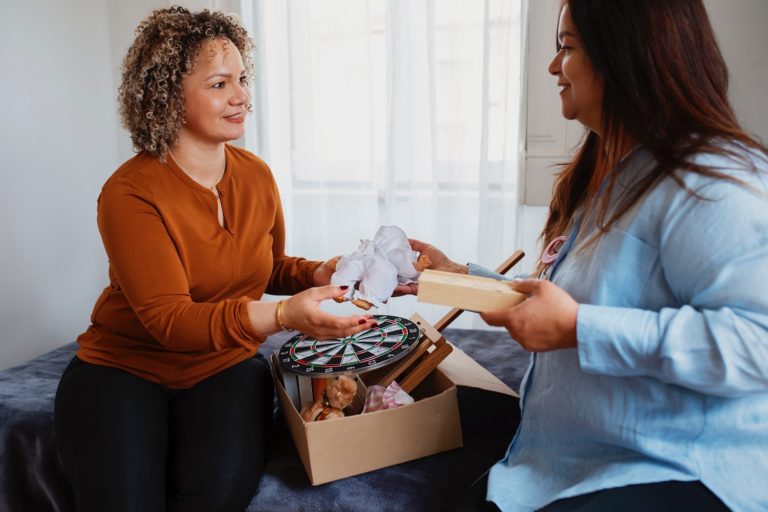 TheREDWords.website/BLOG page. A photo of two women bartering.