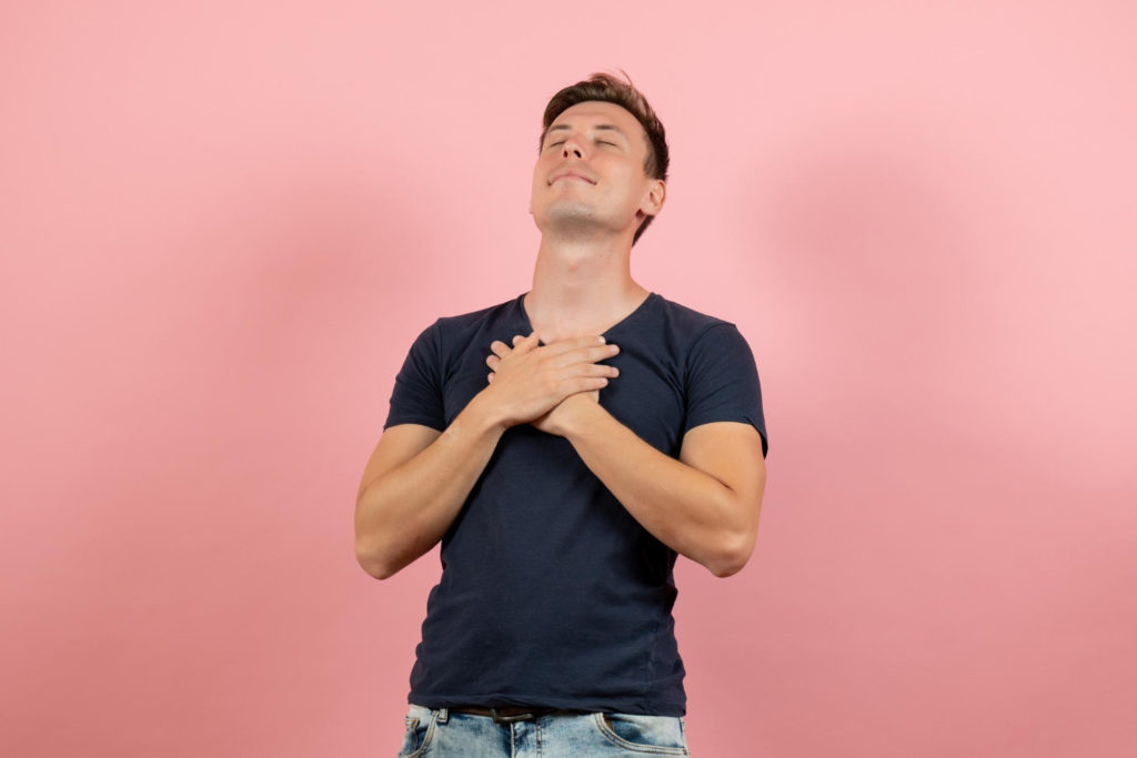 TheREDWords.website/BLOG page. A photo of a man standing and looking up to heaven with his hands crossed over his chest.