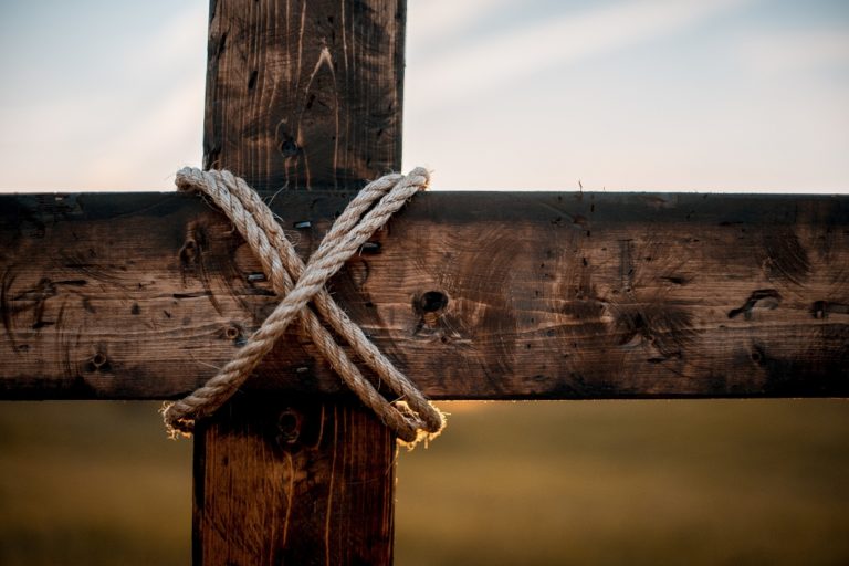 TheREDWords.website/BLOG page. A closeup photo of a wooden cross wrapped in rope.