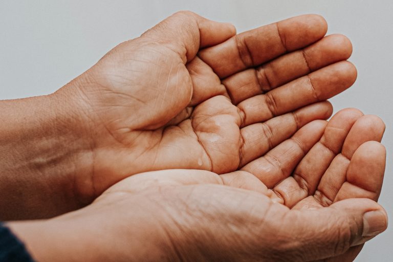 TheREDWords.website/BLOG page. A photo of two hands cupped together.