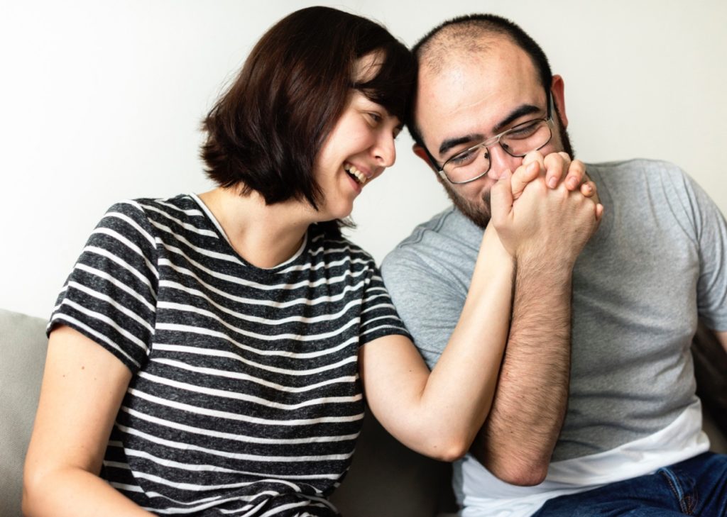 TheREDWords.website/BLOG page. A photo of a happy couple. The man is kissing the woman's hand.