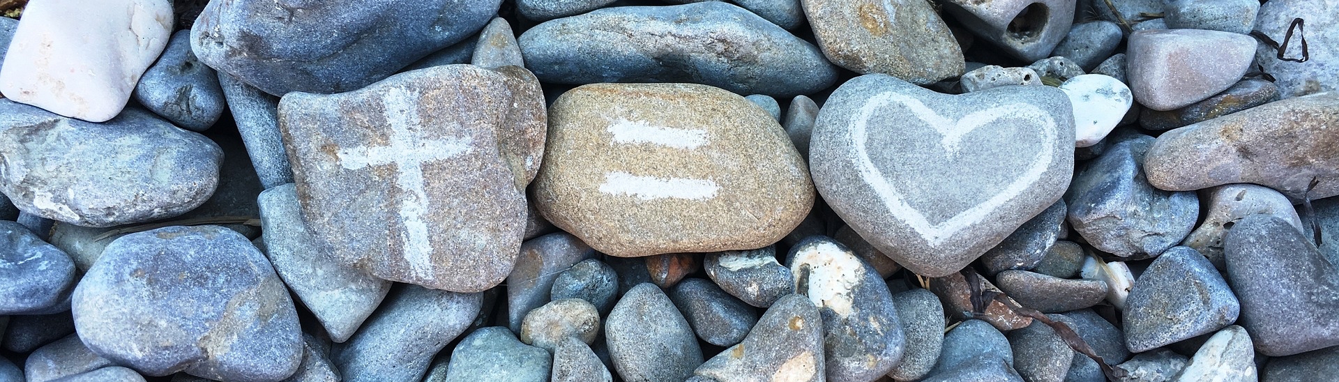 TheREDWords.website/BLOG page. A photo of river rocks painted with a cross and a heart.