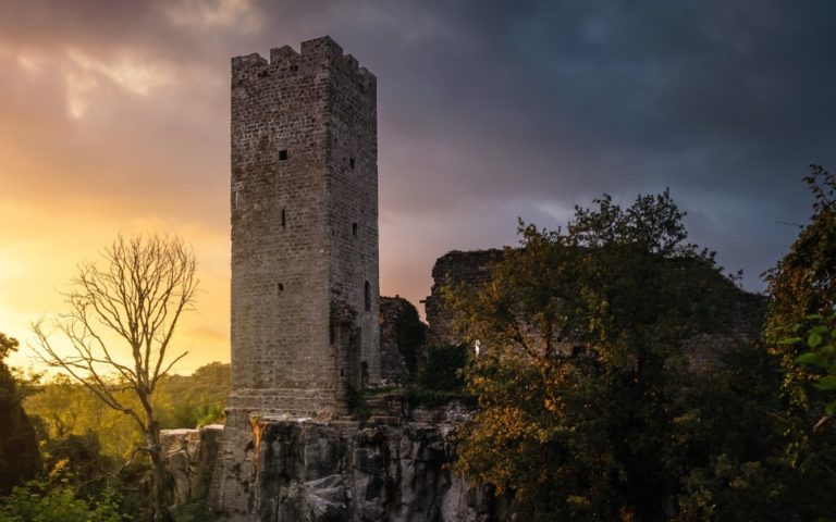 TheREDWords.website/BLOG page. A photo of a castle in ruins at sunset.