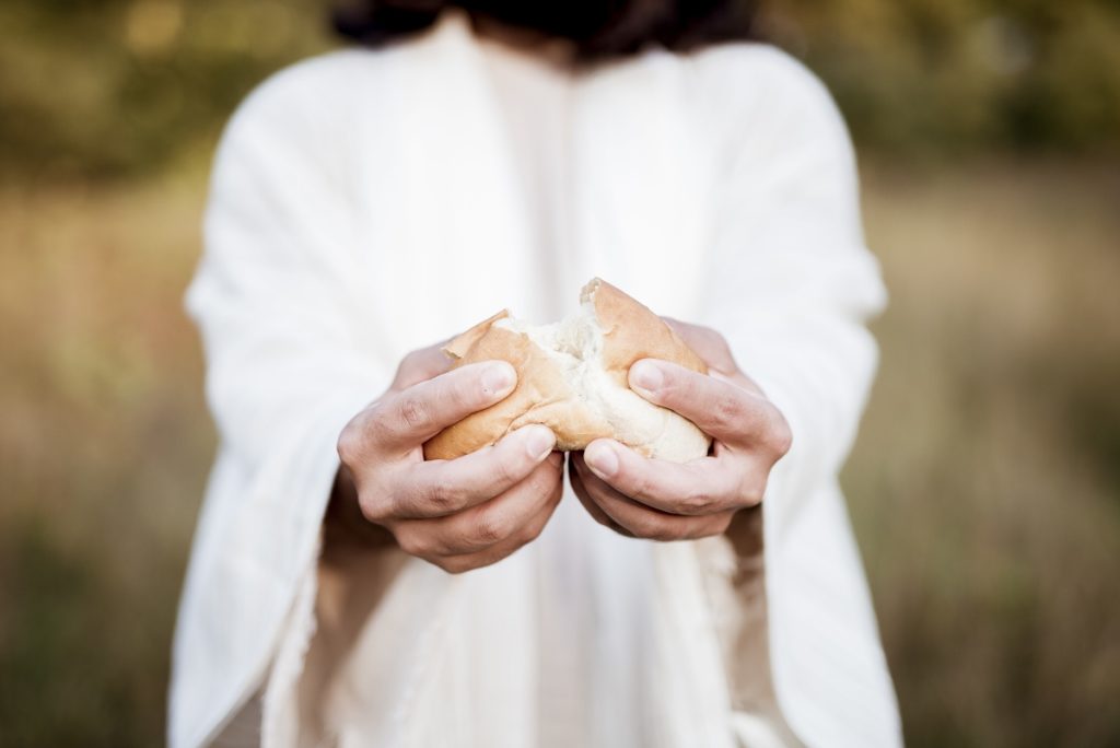 TheREDWords.website/BLOG page. A photo of the Lord Jesus Christ breaking bread.