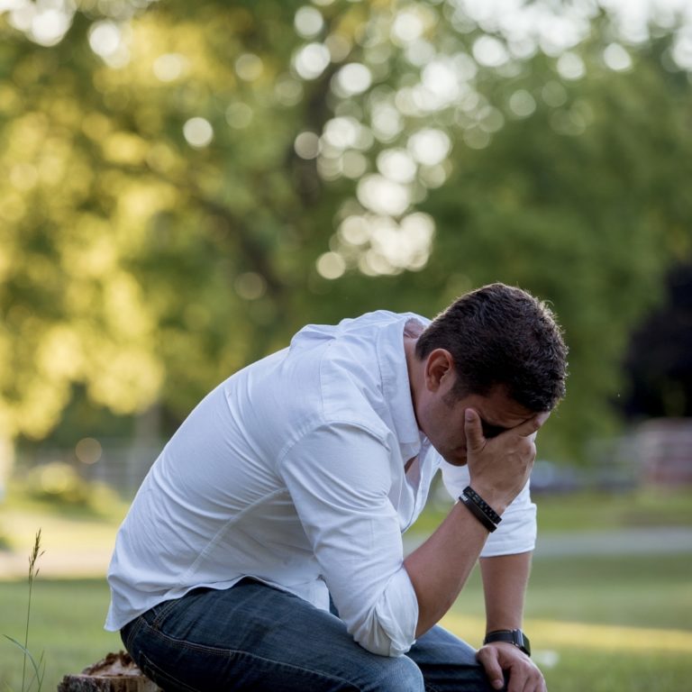 TheREDWords.website/Prayer Starter. A photo of a young man kneeling in repentance.